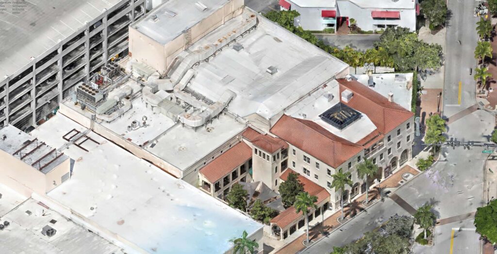 Aerial photogrammetry model of a rooftop block with red tile roofs and rooftop equipment