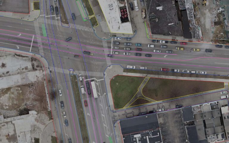 Plan survey linework over aerial of a city intersection