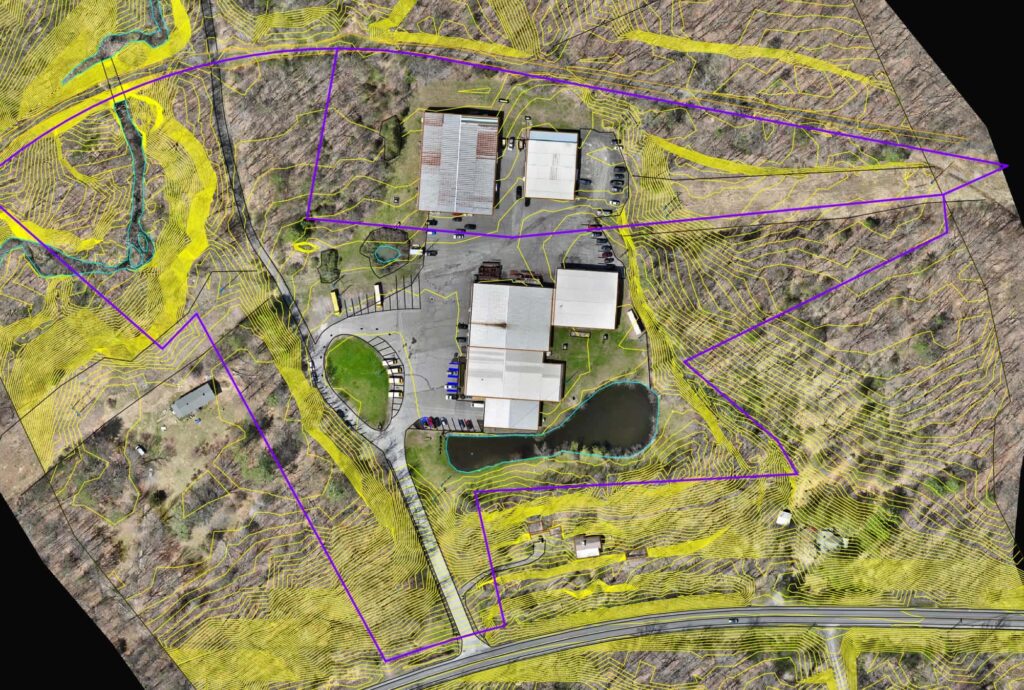 Topographic linework over aerial orthomosaic of a site